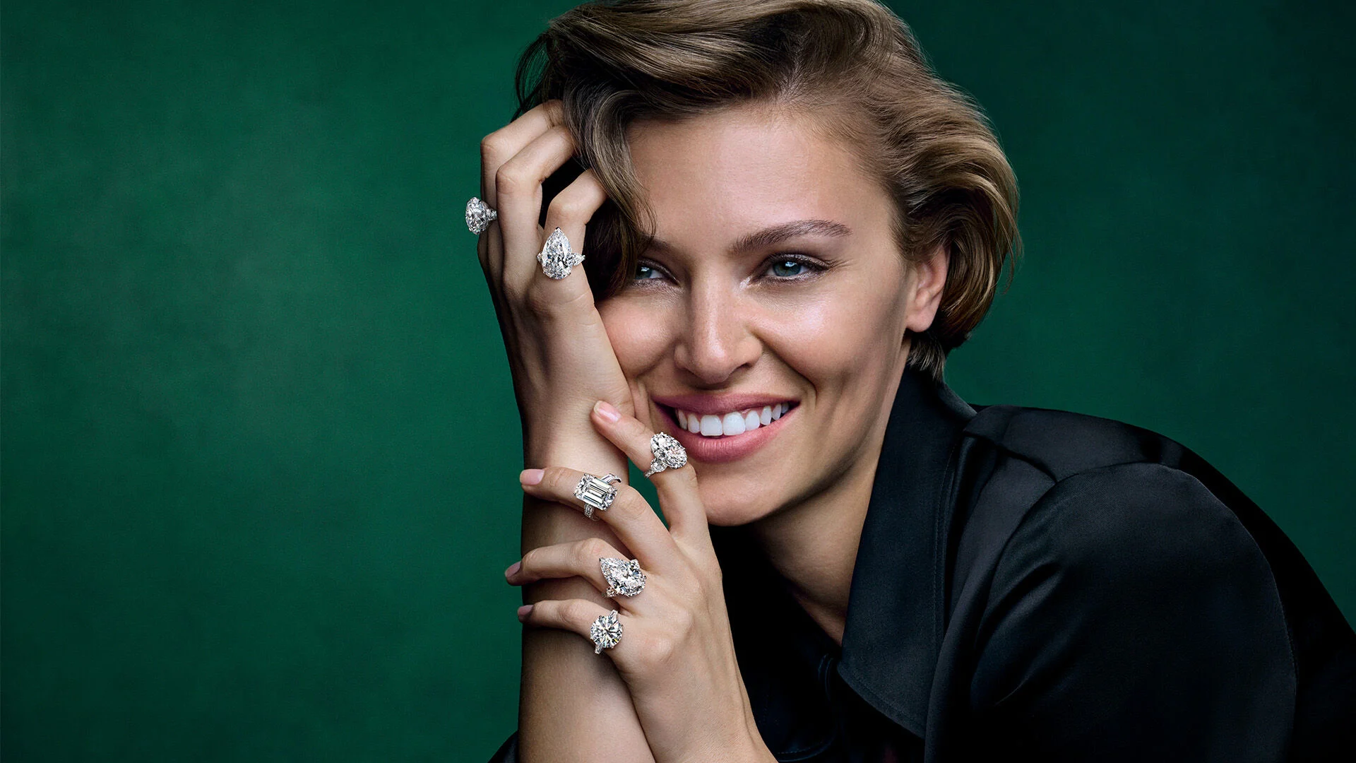 Model wearing five Arvelle diamond rings across both hands