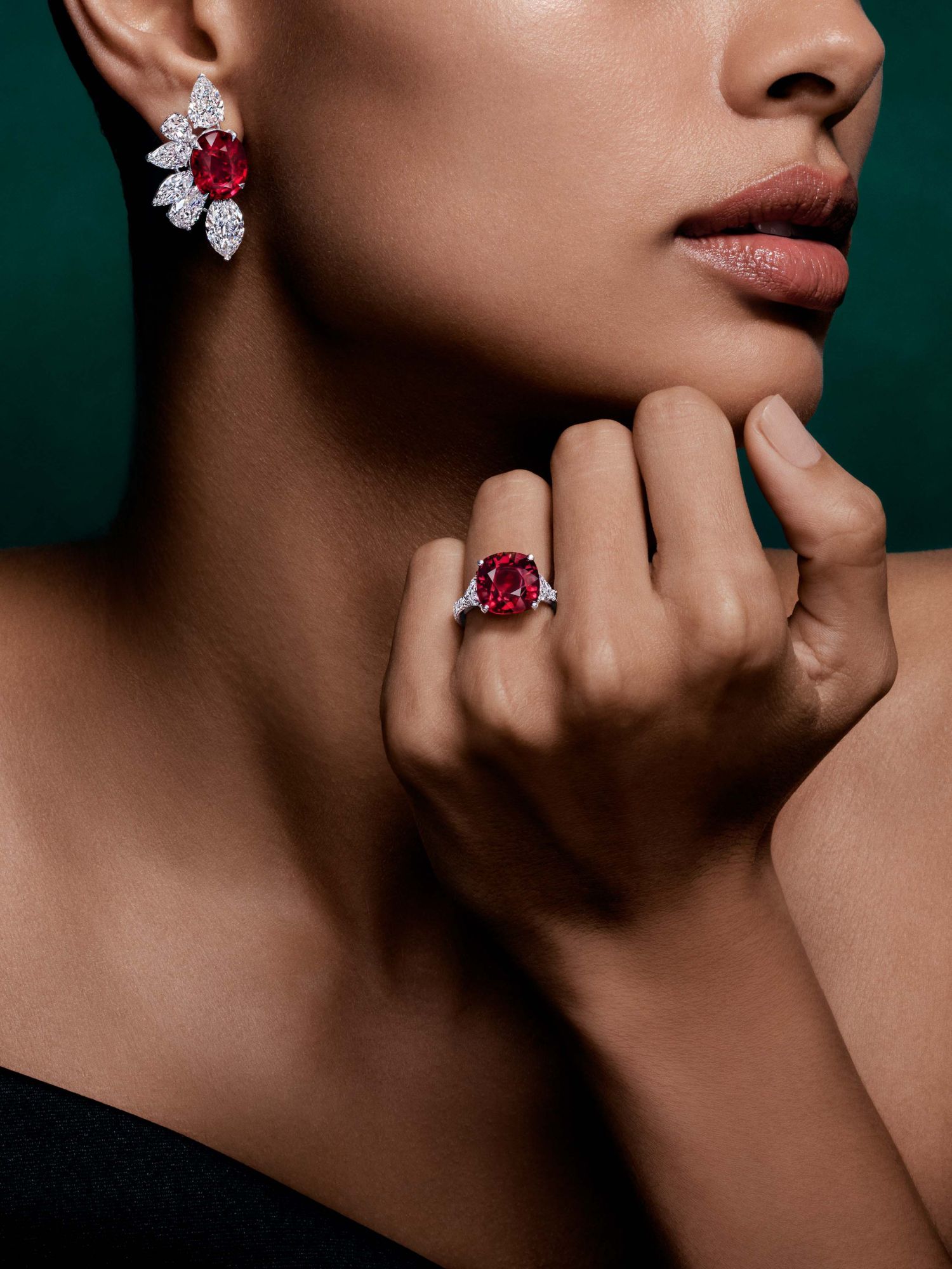 Close-up of an Arvelle ruby and diamond earring and ring