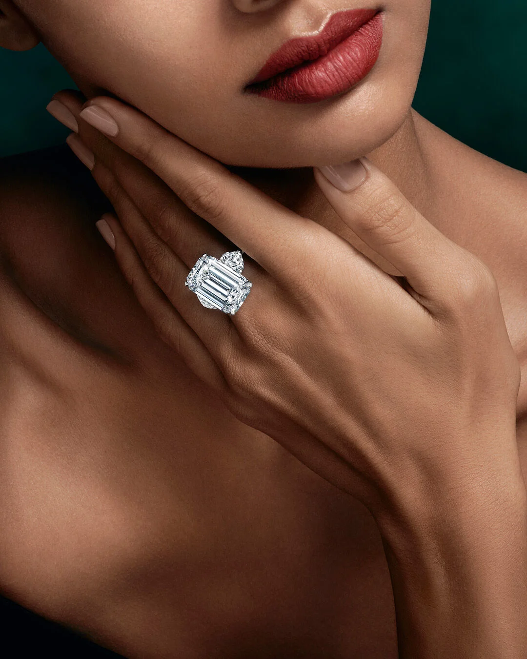 Close-up of an Arvelle emerald and diamond ring