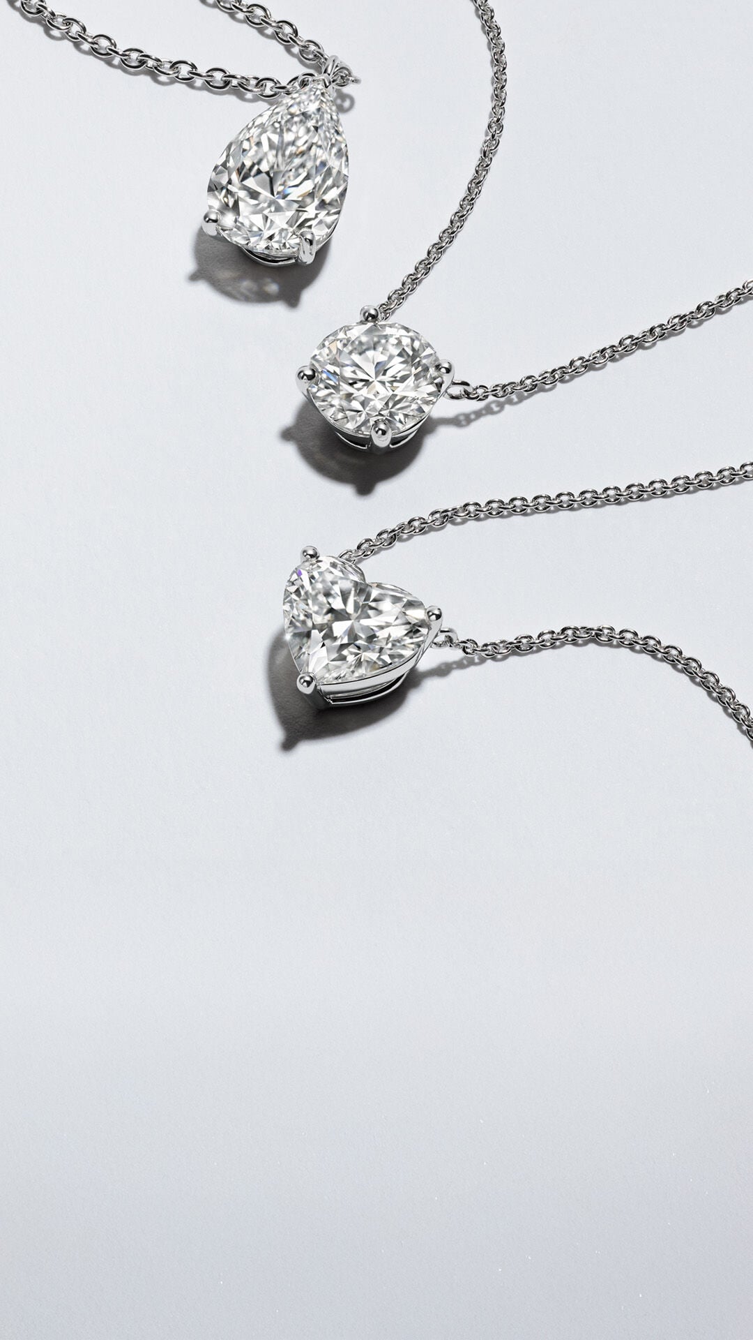 Three Arvelle diamond pendant necklaces